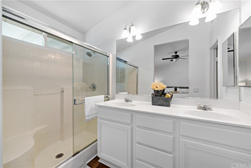 36661 Beech Street Winchester, CA 92596 - Photo 22 of 33 a bathroom with a double vanity sink mirror and shower