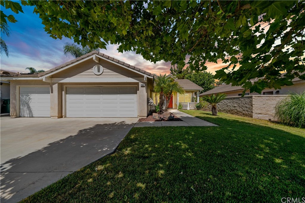 36661 Beech Street Winchester, CA 92596 - Photo 33 of 33 a front view of a house with a yard and garage