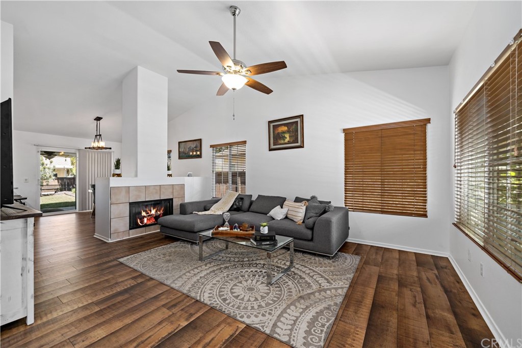 36661 Beech Street Winchester, CA 92596 - Photo 6 of 33 a living room with fireplace furniture rug and wooden floor