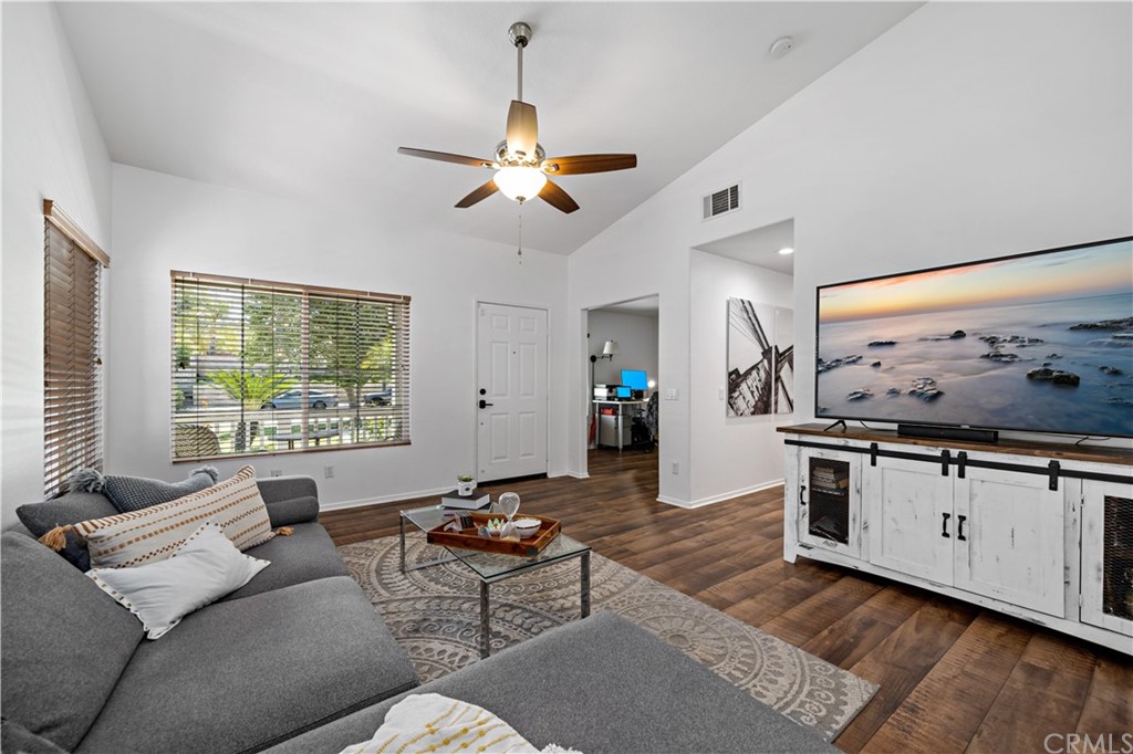 36661 Beech Street Winchester, CA 92596 - Photo 8 of 33 a living room with stainless steel appliances kitchen island furniture and a large window