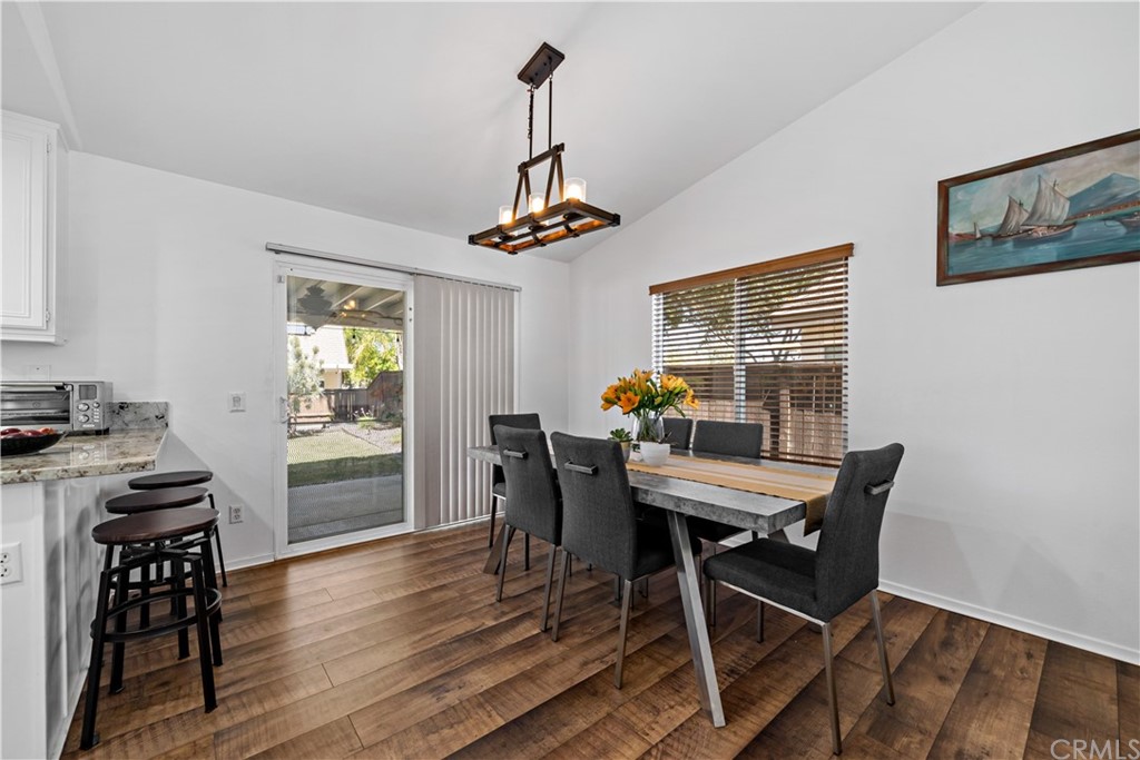 36661 Beech Street Winchester, CA 92596 - Photo 9 of 33 a view of a dining room with furniture window and wooden floor