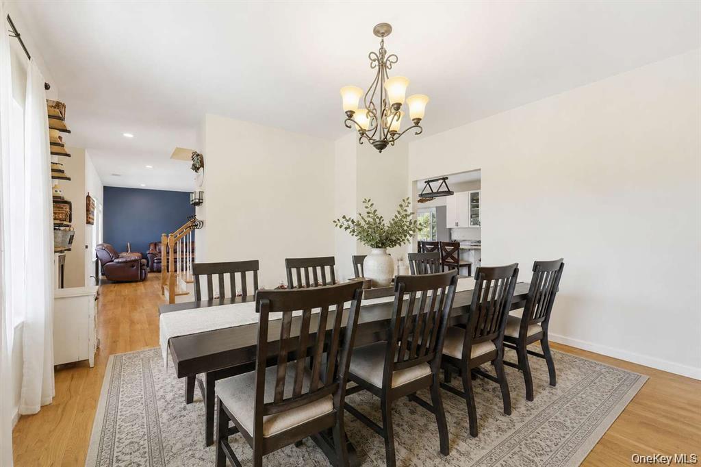 133 Old Chester Road Goshen, NY 10924 - Photo 12 of 33 a view of a dining room with furniture and chandelier