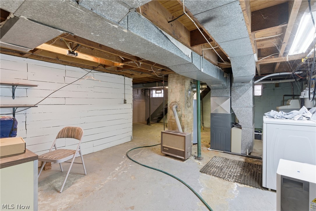 6291 Downs Road Northwest Warren, OH 44481 - Photo 26 of 44 Below grade area with washer / clothes dryer and heating unit