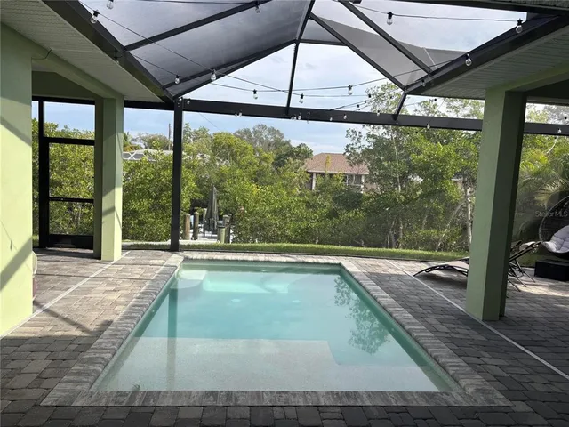 a view of swimming pool with a porch