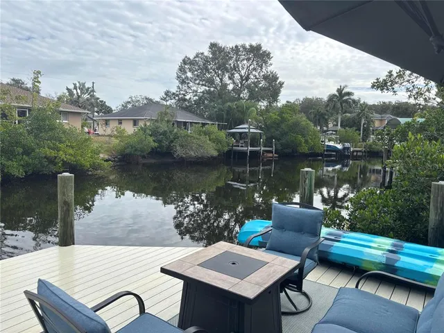 a view of a lake with furniture