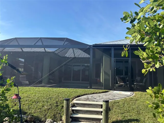a view of a backyard with plants