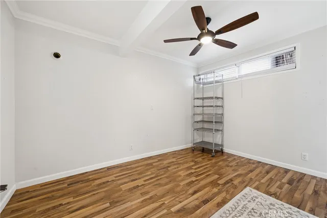 a view of a room with a wooden floor