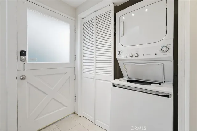 a view of staircase with white walls and railing