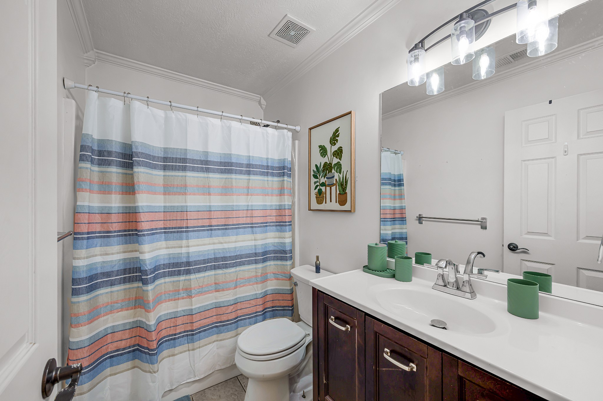 23 Matrix Cove Jackson, TN 38305 - Photo 14 of 16 a bathroom with a sink a toilet a shower and a mirror