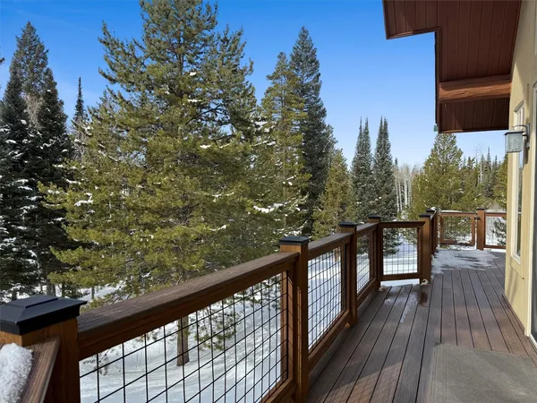 a view of a balcony with wooden floor