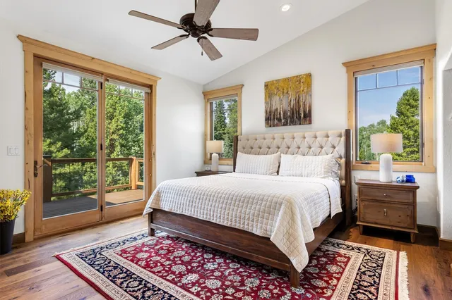 a bedroom with a large bed and a window