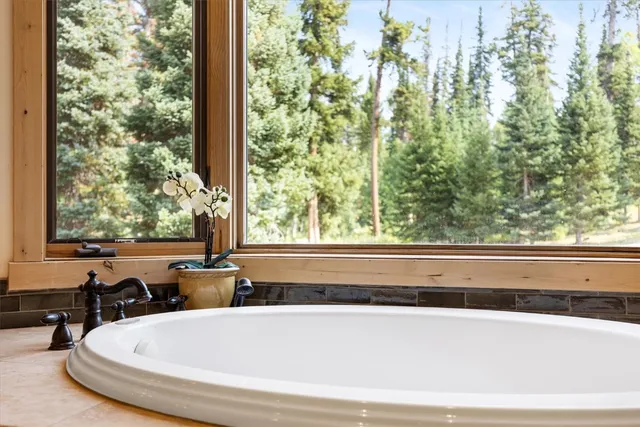 a bath tub sitting next to a window