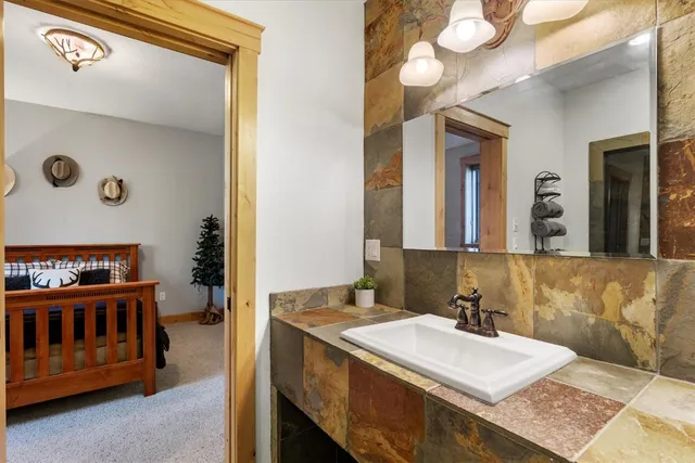 a bathroom with a sink and a mirror