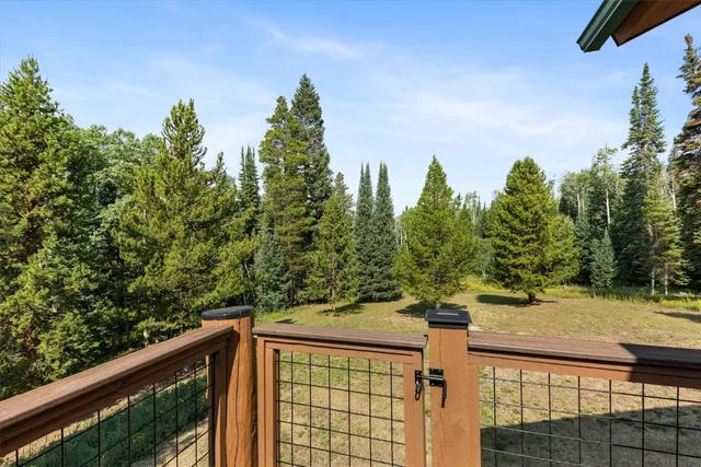 a view of a street from a balcony with outdoor space