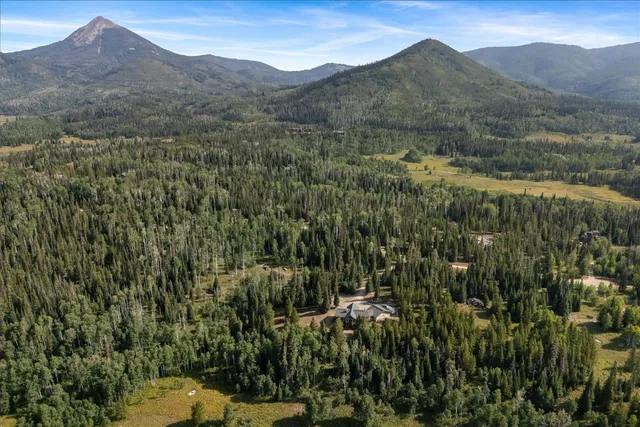 a view of a town with mountains in the background