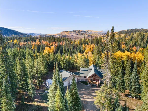 a view of a town with mountains in the background