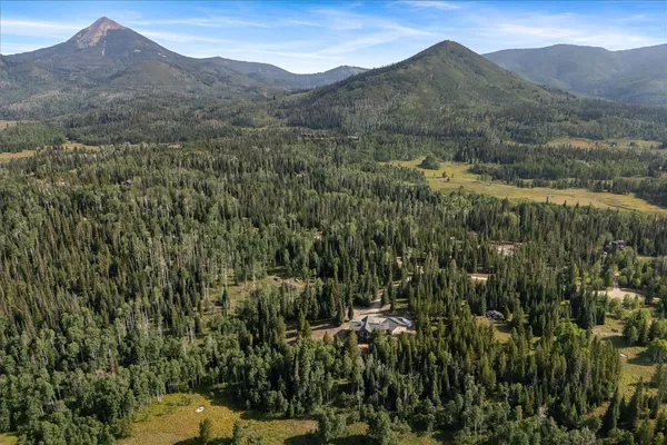 a view of a town with mountains in the background