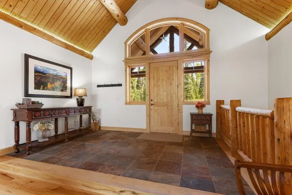 a view of a livingroom with furniture and staircase