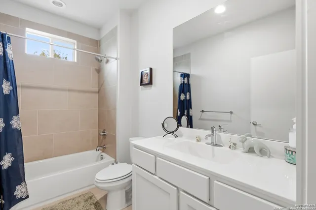 a view of a livingroom with furniture and a window
