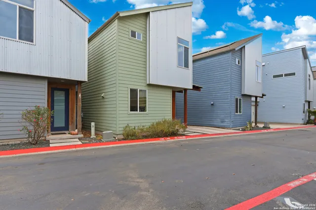 a view of a house with a street