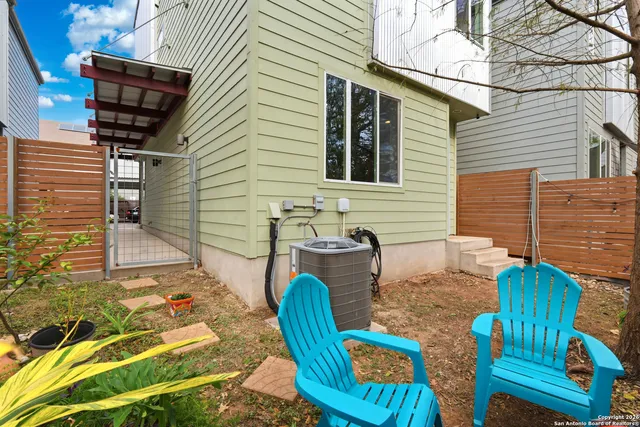 an aerial view of residential building with parking