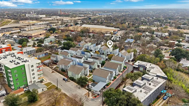a large white kitchen with a large window
