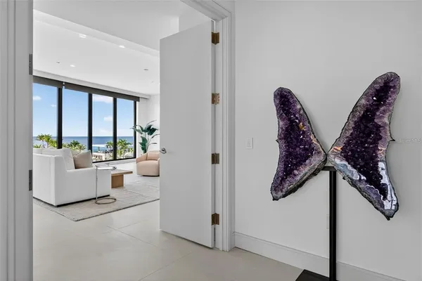 a living room with furniture tv and a large window