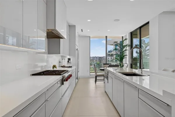 a living room filled with furniture and a large window