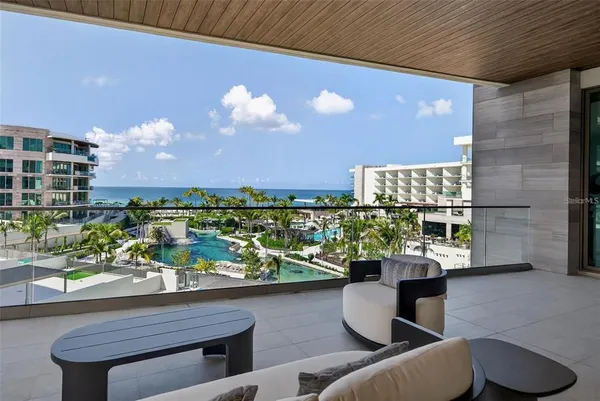 a view of a chairs and table in a patio