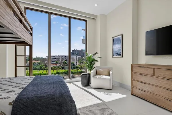 a bathroom with a granite countertop toilet sink mirror and vanity