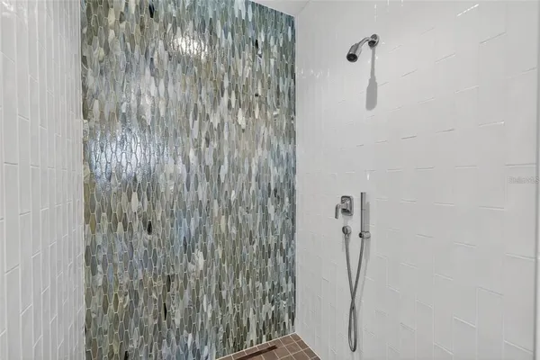 a kitchen with kitchen island a dining table and chairs