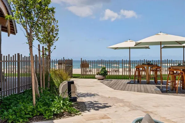 a view of a patio filled with furniture