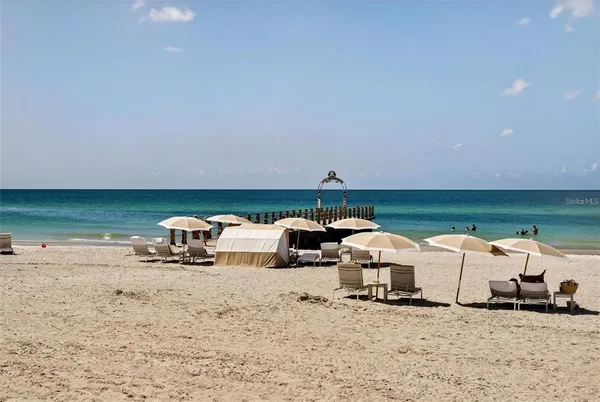 a very nice looking living room with furniture and a large window