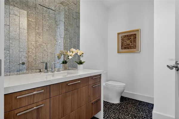 a kitchen with stainless steel appliances a sink a stove and a window