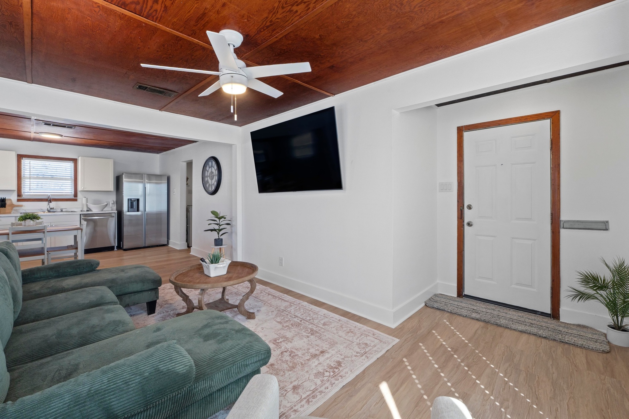 1308 East 12th Street, Unit A Austin, TX 78702 - Photo 7 of 25 a living room with furniture a ceiling fan and a rug