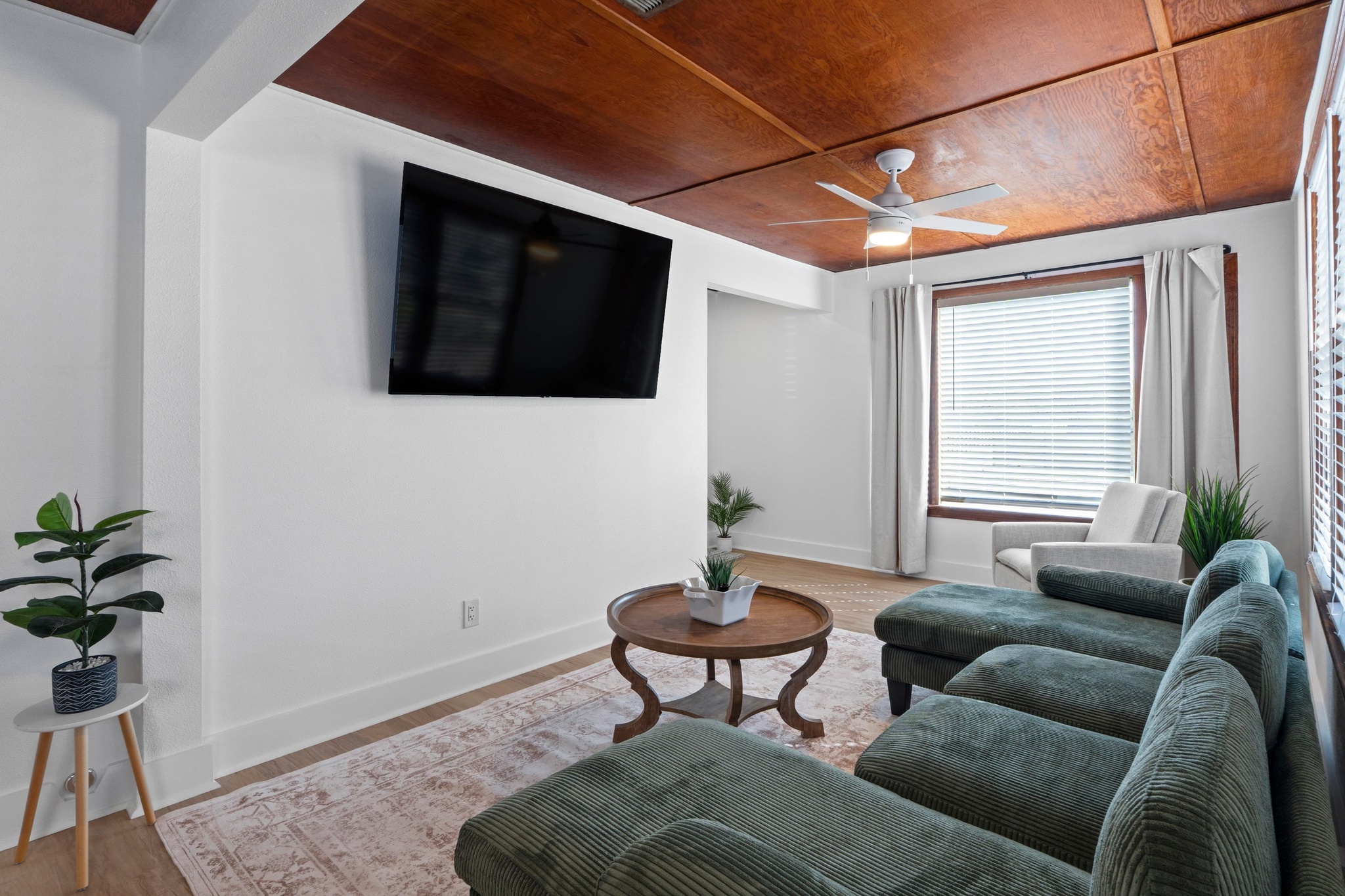 1308 East 12th Street, Unit A Austin, TX 78702 - Photo 8 of 25 a living room with furniture a flat screen tv and a window