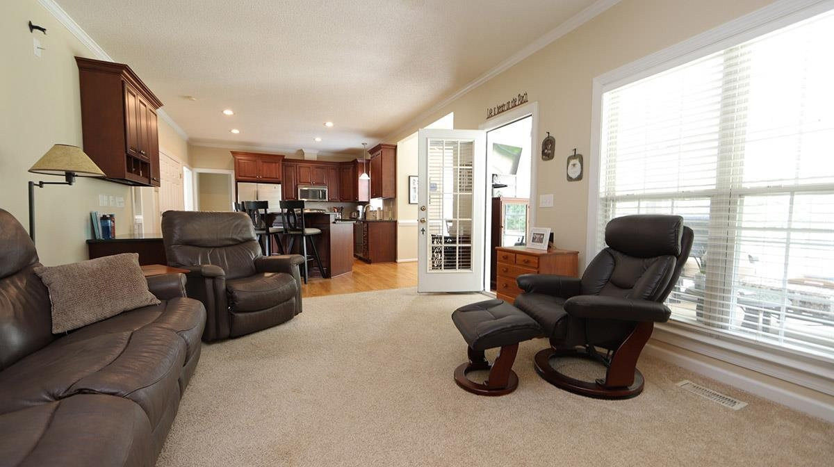 3820 Evander Way Raleigh, NC 27613 - Photo 16 of 30 A view of the from the family room through to the kitchen. Family Room to Kitchen