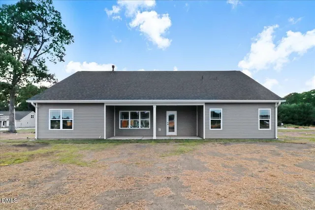 a view of a room with wooden floor chandelier and window