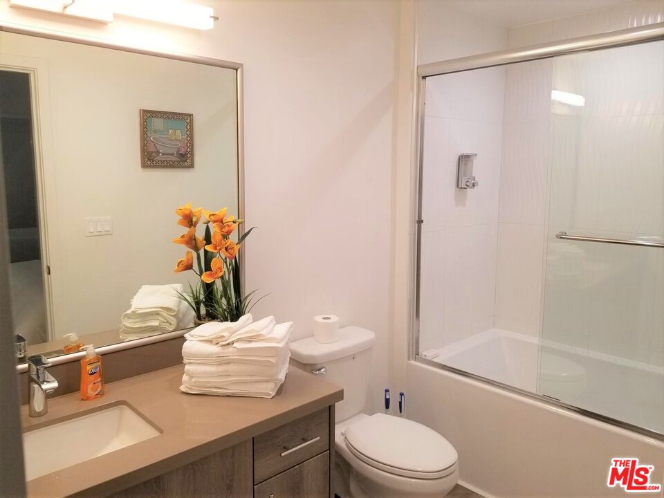 744 Hartford Avenue, Unit 206 Los Angeles, CA 90017 - Photo 12 of 23 a bathroom with a sink a toilet and shower