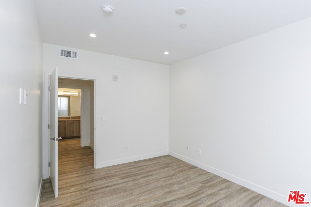 744 Hartford Avenue, Unit 206 Los Angeles, CA 90017 - Photo 15 of 23 a view of an empty room with wooden floor