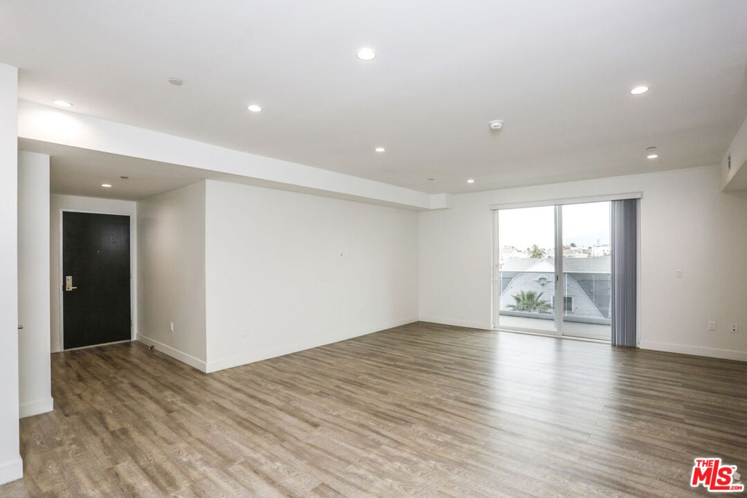 744 Hartford Avenue, Unit 206 Los Angeles, CA 90017 - Photo 5 of 23 a view of an empty room with wooden floor