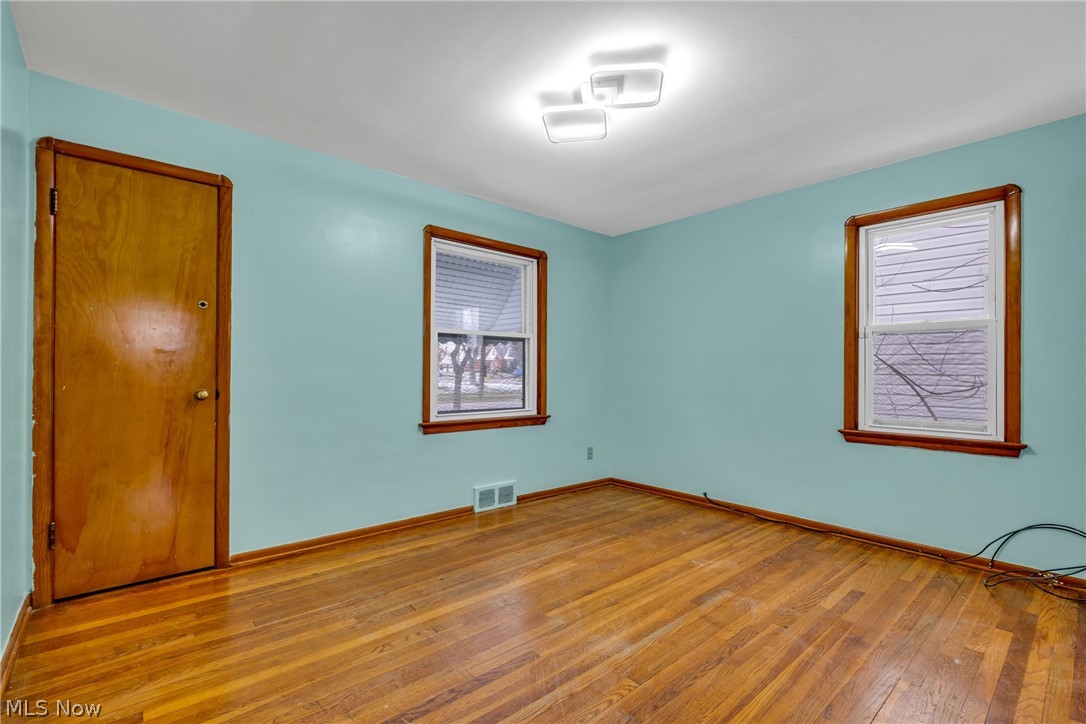 5731 Dunham Road Maple Heights, OH 44137 - Photo 12 of 28 first floor bedroom featuring dark hardwood / wood-style flooring