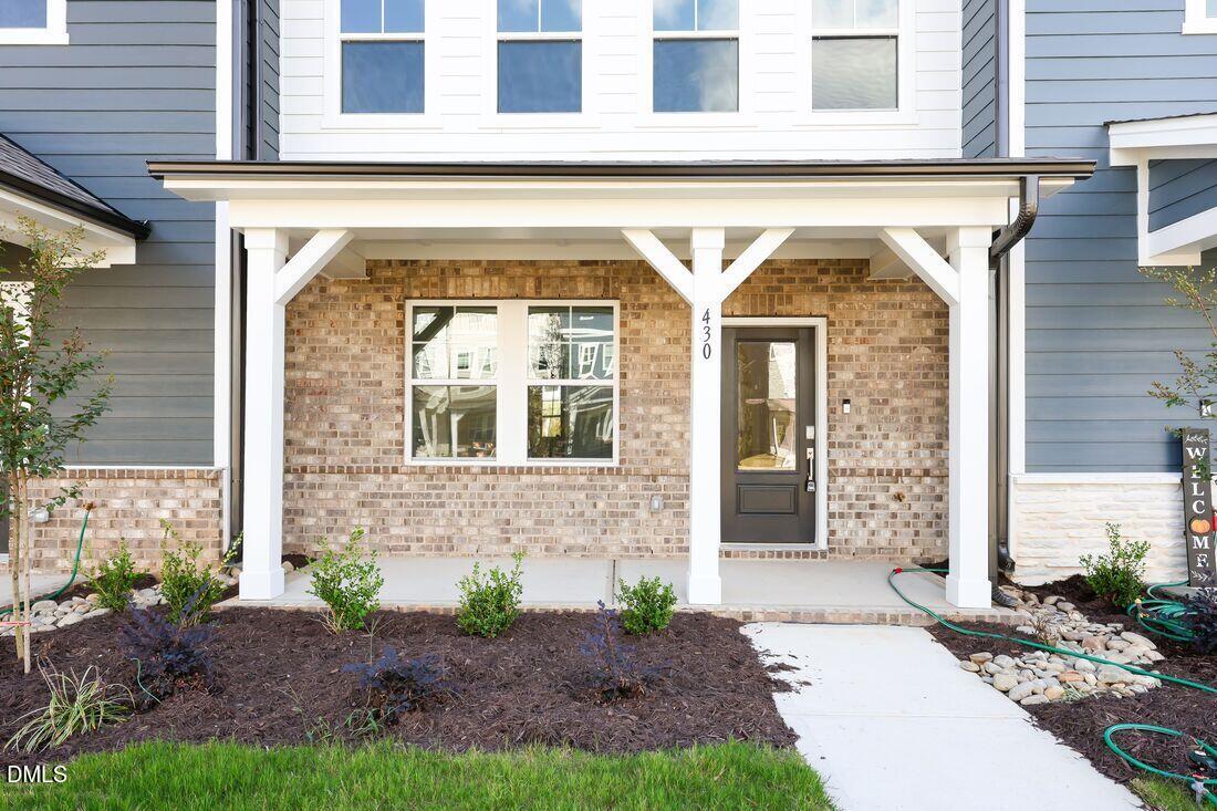 430 Rowe Way Knightdale, NC 27545 - Photo 2 of 51 a front view of a house with garden