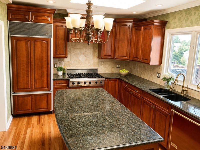 178 East Lindsley Road, Unit 2 Cedar Grove, NJ 07009 - Photo 5 of 28 a kitchen with stainless steel appliances granite countertop wooden cabinets a sink and a stove