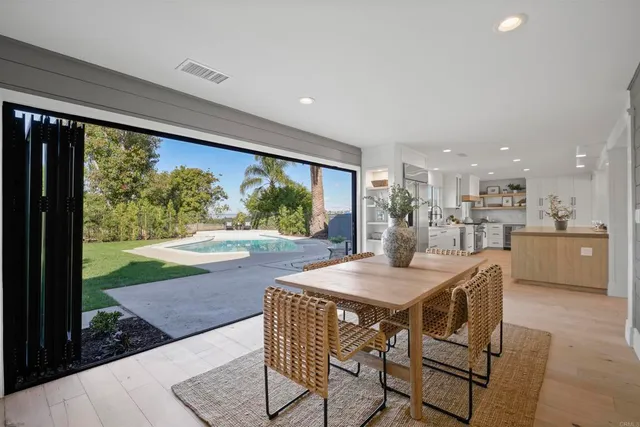 a view of a dining table and chairs in a room