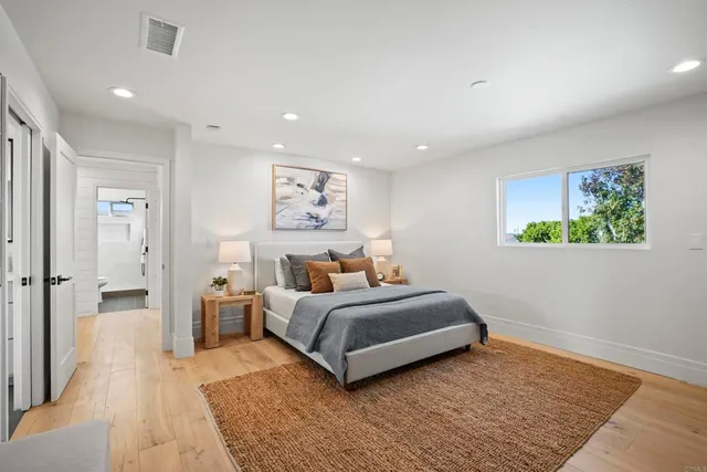 a bedroom with a bed and a couch