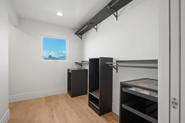 a view of an empty room with a fireplace