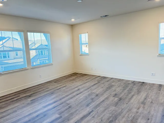 a view of balcony with wooden floor