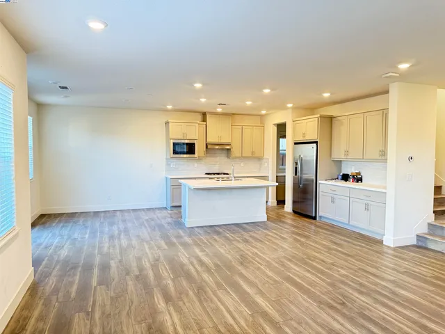 a spacious bathroom with a double vanity sink and a mirror