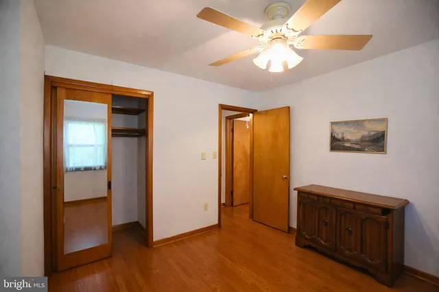 a view of a livingroom with a chandelier fan